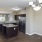a kitchen with a bar and a bar stool