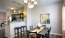 a kitchen with a dining table and chairs