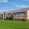 a group of apartments with a lawn