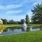 a pond with a fountain in it
