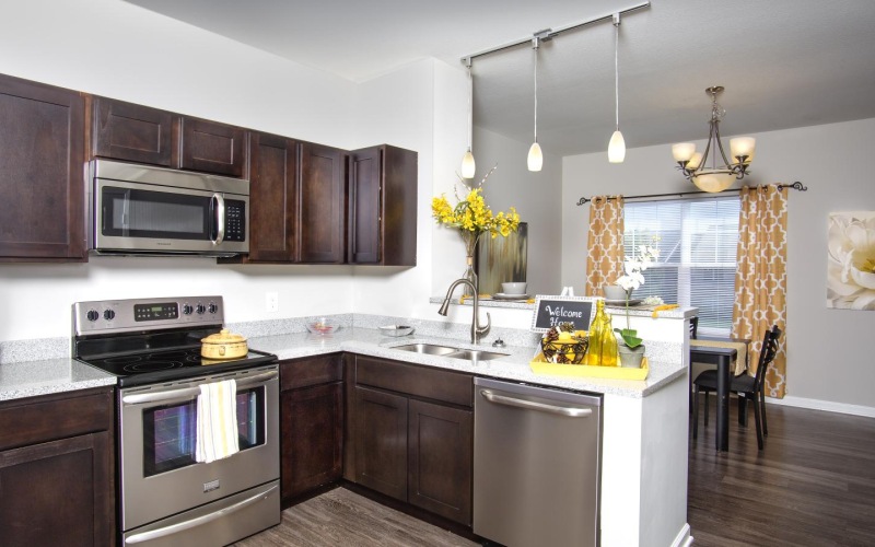 a kitchen with wooden cabinets