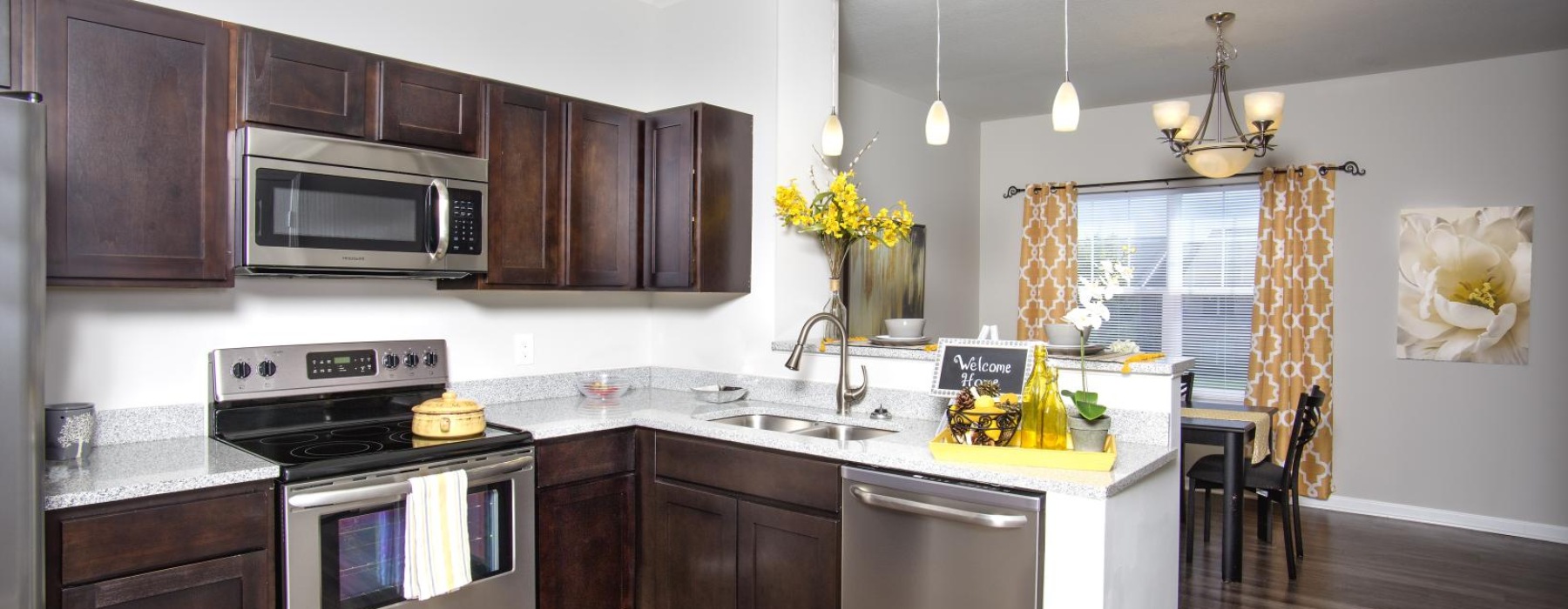 a kitchen with wooden cabinets