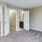 a bedroom with white doors