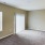 a room with a carpet and a window