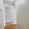 a hallway with white walls